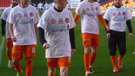 Dundee United warming up in Prostate Scotland t shirts