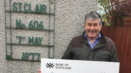 Alex Barrett presenting cheque to Prostate Scotland